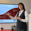 {
																																					A photograph of a G. Seller bereavement support employee giving a presentation
																																			
