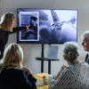 {
																																					Photograph of G. Seller employee discussing funeral wishes with a family
																																			