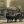 {
																															A historical photograph of a horse-drawn funeral cortege outside the Hinckley office
																													